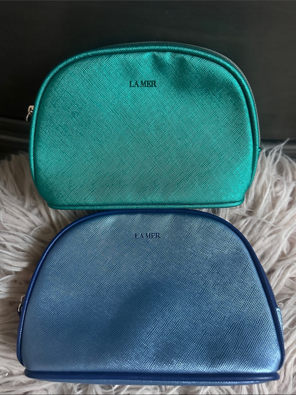 La Mer Metallic Teal and Light Blue Cosmetic Pouches